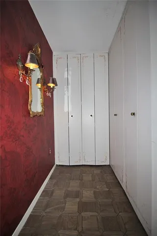 a view of an empty room with windows