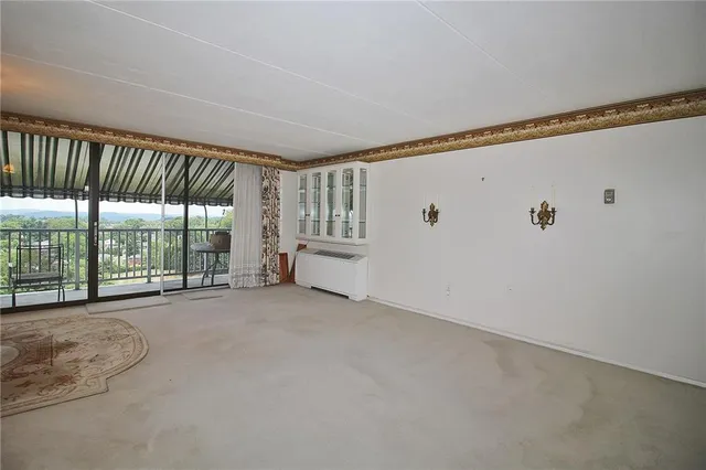 a view of an empty room with windows