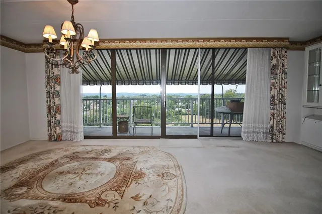 a view of a livingroom with a floor to ceiling window