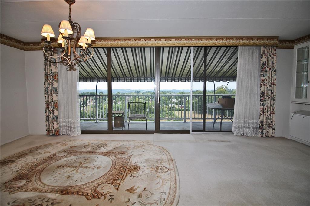 1150 Bower Hill Road, Unit 912A Pittsburgh, PA 15243 - Photo 18 of 39 a view of a livingroom with furniture and floor to ceiling window