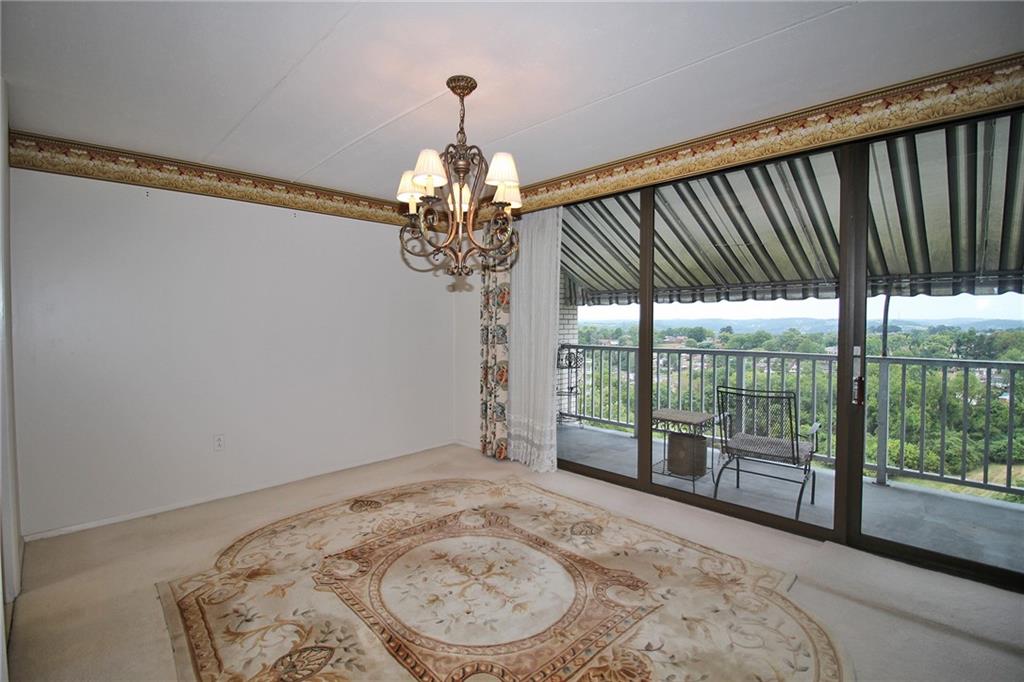 1150 Bower Hill Road, Unit 912A Pittsburgh, PA 15243 - Photo 19 of 39 a view of a livingroom with a floor to ceiling window
