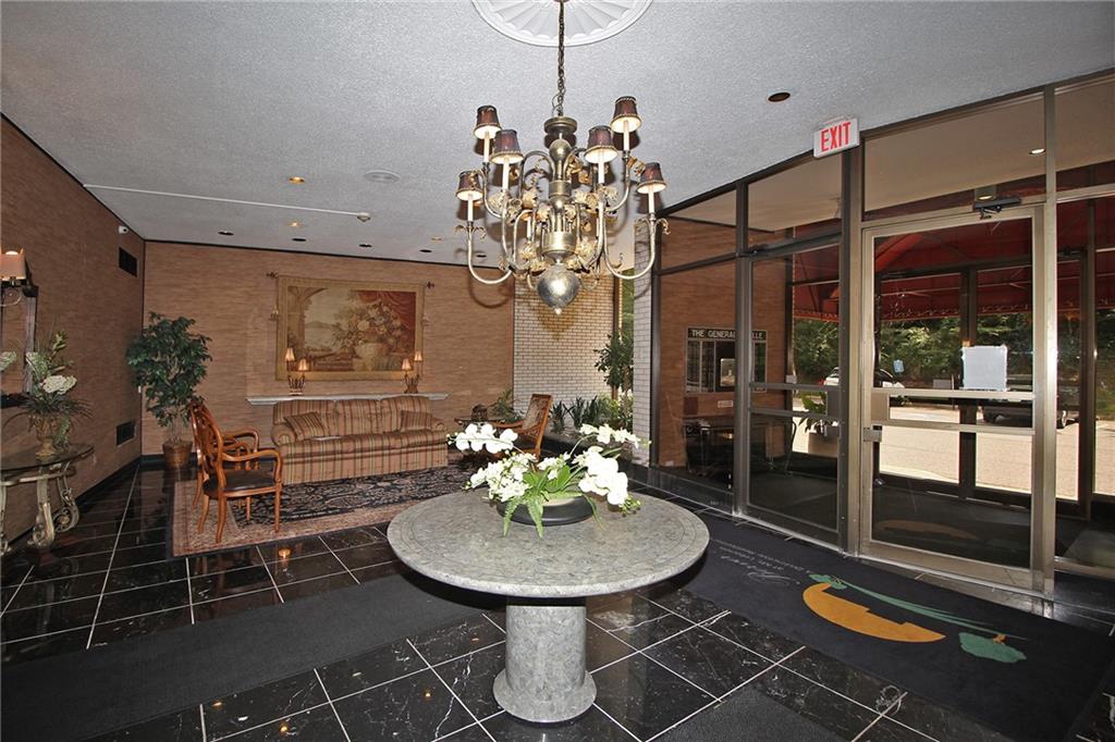 1150 Bower Hill Road, Unit 912A Pittsburgh, PA 15243 - Photo 3 of 39 a view of a dining room with furniture and chandelier