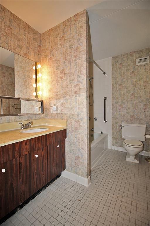 1150 Bower Hill Road, Unit 912A Pittsburgh, PA 15243 - Photo 37 of 39 a spacious bathroom with a double vanity sink a toilet and a mirror