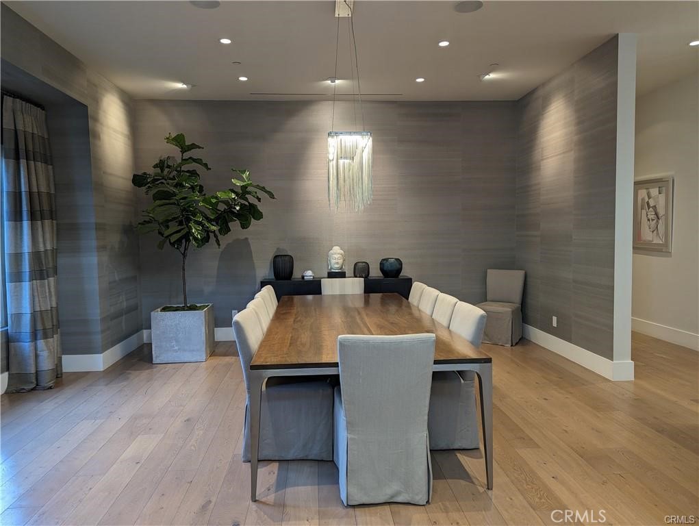 17950 Rancho Street Encino, CA 91316 - Photo 12 of 35 a dining room with furniture and a potted plant