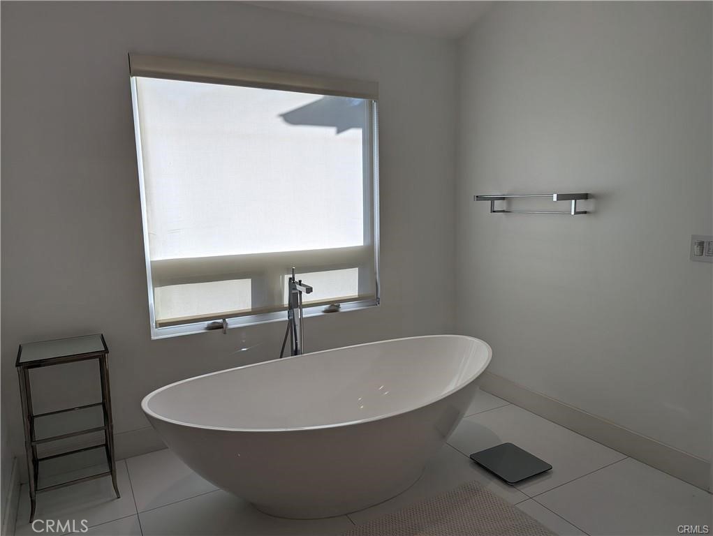 17950 Rancho Street Encino, CA 91316 - Photo 20 of 35 a bathroom with a sink and a mirror