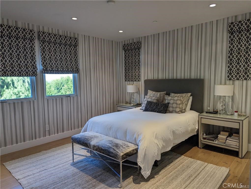 17950 Rancho Street Encino, CA 91316 - Photo 24 of 35 a bedroom with a bed and a fireplace