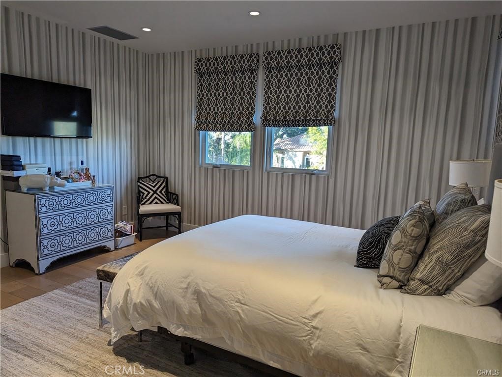 17950 Rancho Street Encino, CA 91316 - Photo 25 of 35 a bedroom with a bed television and a window