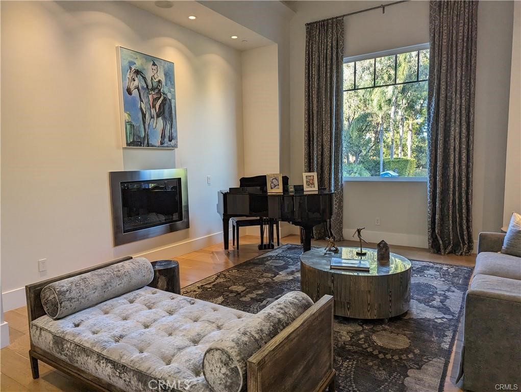 17950 Rancho Street Encino, CA 91316 - Photo 5 of 35 a living room with furniture and a flat screen tv