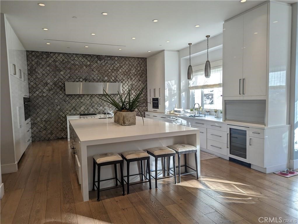 17950 Rancho Street Encino, CA 91316 - Photo 7 of 35 a kitchen with a table chairs sink and cabinets
