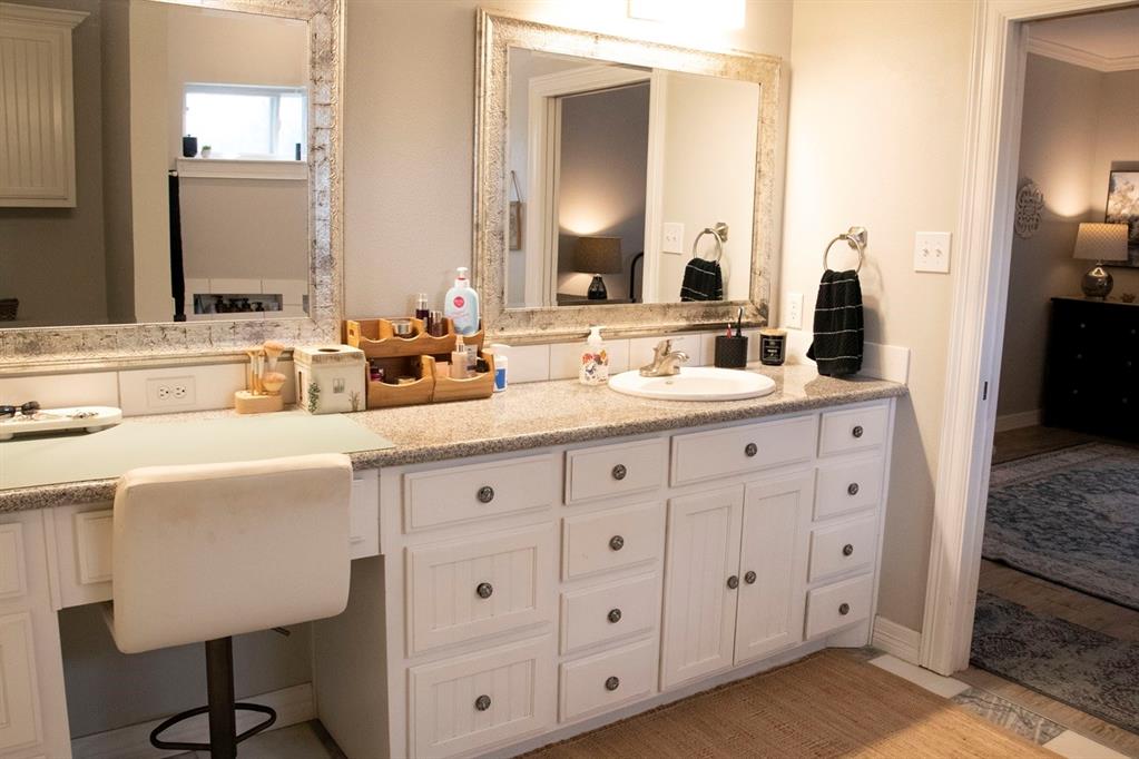 298 Redbud A Mexia, TX 76667 - Photo 18 of 40 a bathroom with a double vanity sink and mirror