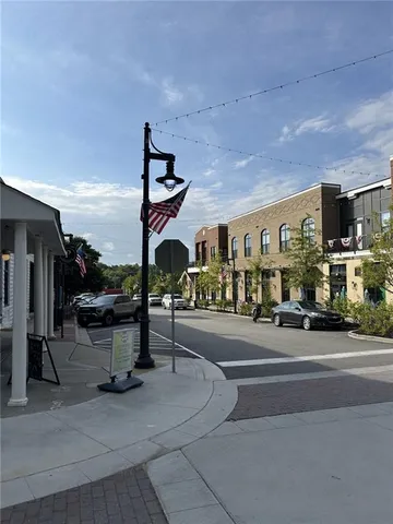 a view of a street with sitting area