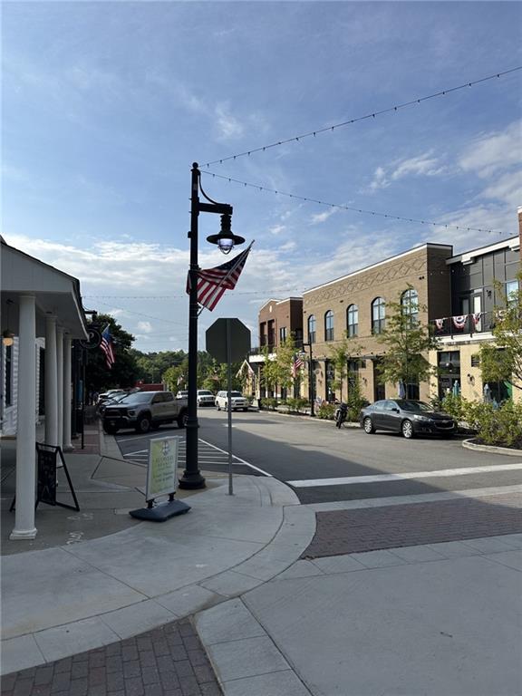 6140 Jones Road Flowery Branch, GA 30542 - Photo 3 of 4 a view of a street with sitting area