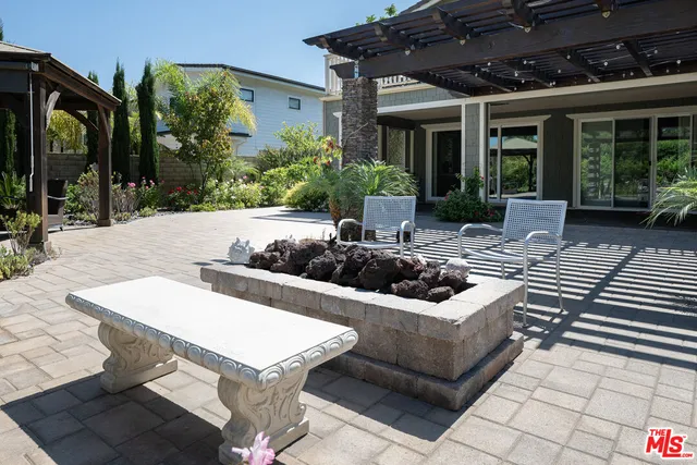 a view of a room with wooden floor and floor to ceiling window