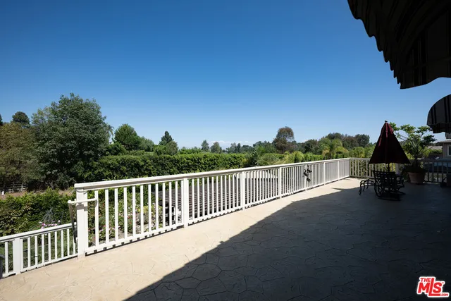 a bathroom with a double vanity sink a mirror and a bathtub