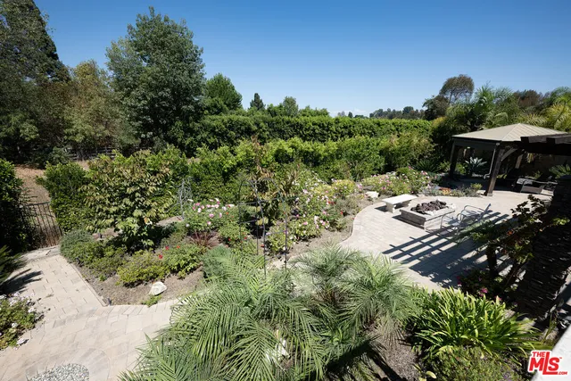 an empty room with wooden floor and sliding door