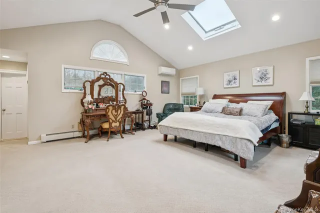 a bedroom with bed and a chandelier