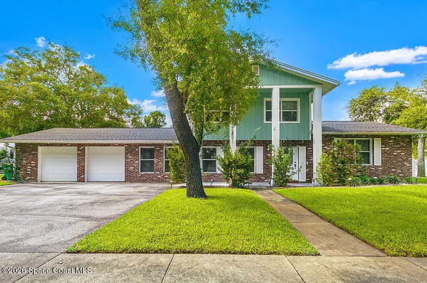 front view of a house with a yard