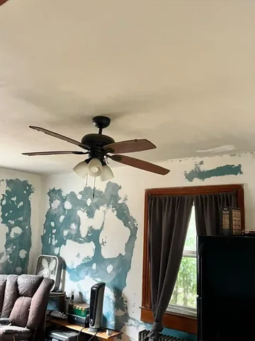 a view of room with window and flowerpot