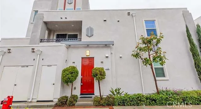 a vase with flowers sitting on a table