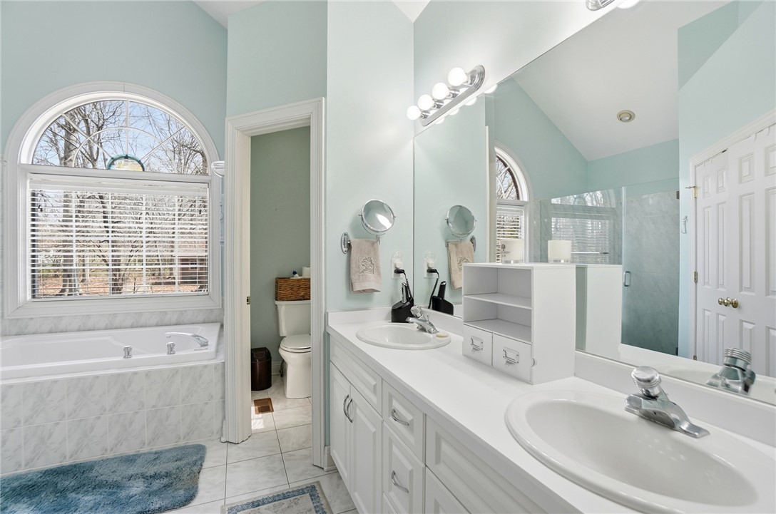 472 Timber Walk Court Springboro, OH 45066 - Photo 22 of 86 This serene primary bathroom offers a spacious layout, ideal for daily routines.
