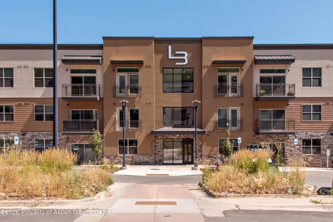 a front view of a building with street view