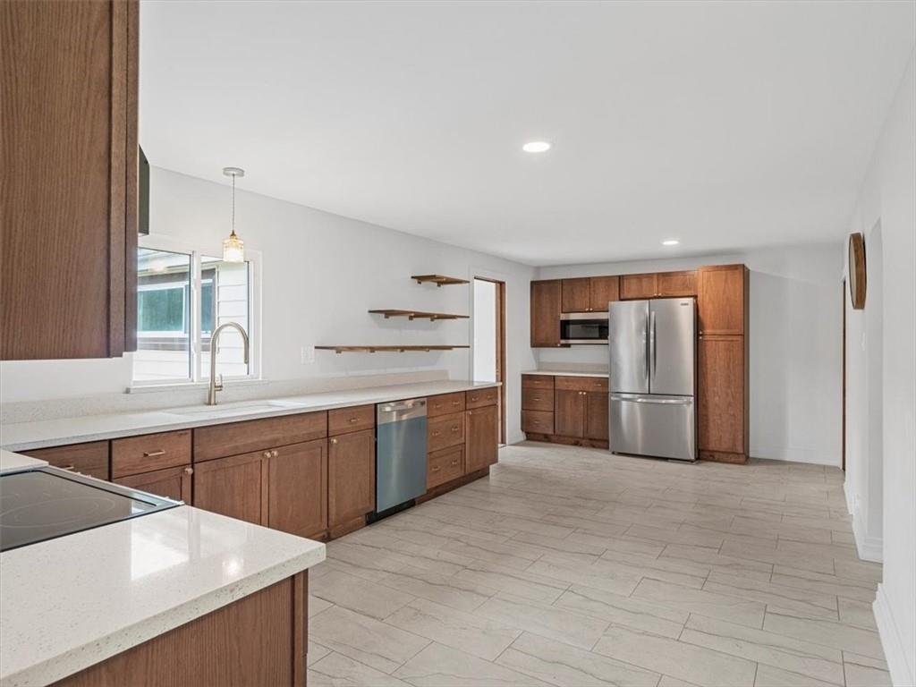 1403 Blackhawk Road Darlington, PA 16115 - Photo 13 of 29 a large kitchen with cabinets and stainless steel appliances