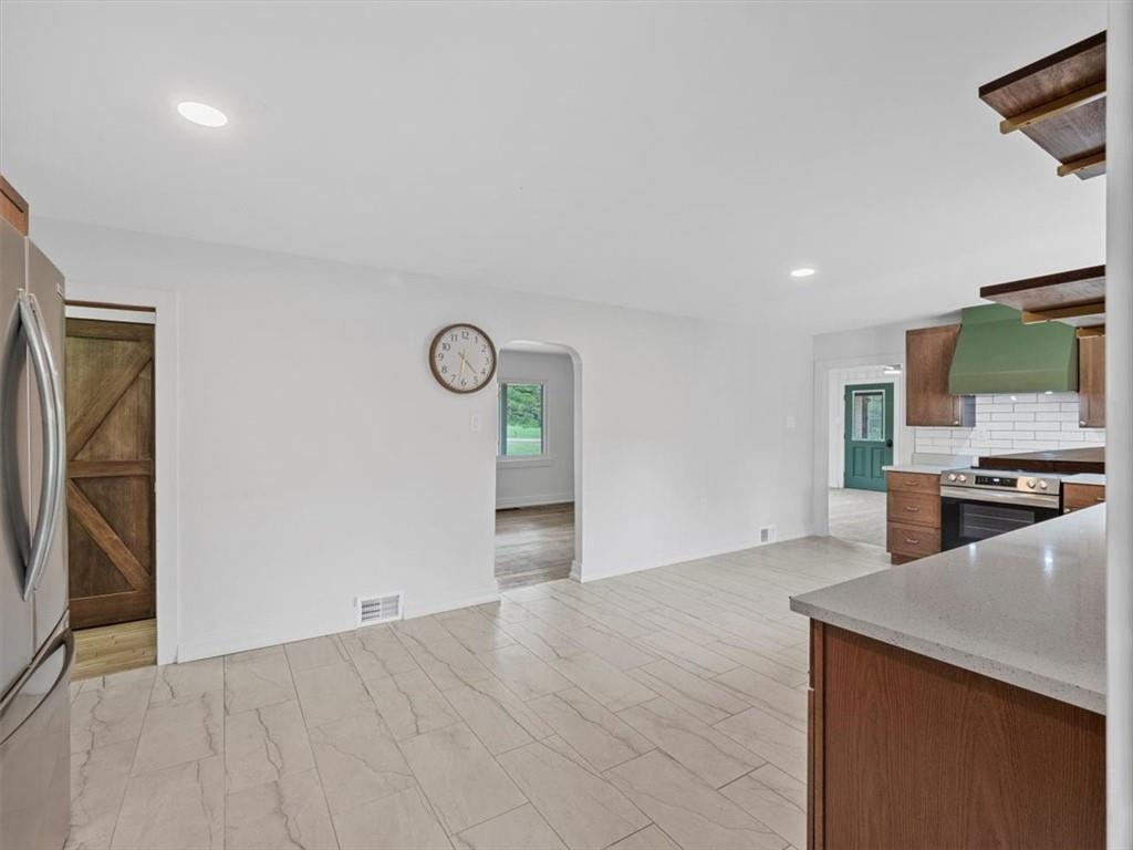 1403 Blackhawk Road Darlington, PA 16115 - Photo 14 of 29 a view of a kitchen with a sink and a refrigerator