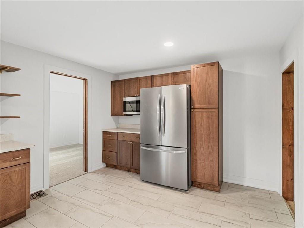 1403 Blackhawk Road Darlington, PA 16115 - Photo 15 of 29 a metallic refrigerator freezer and a refrigerator in a room