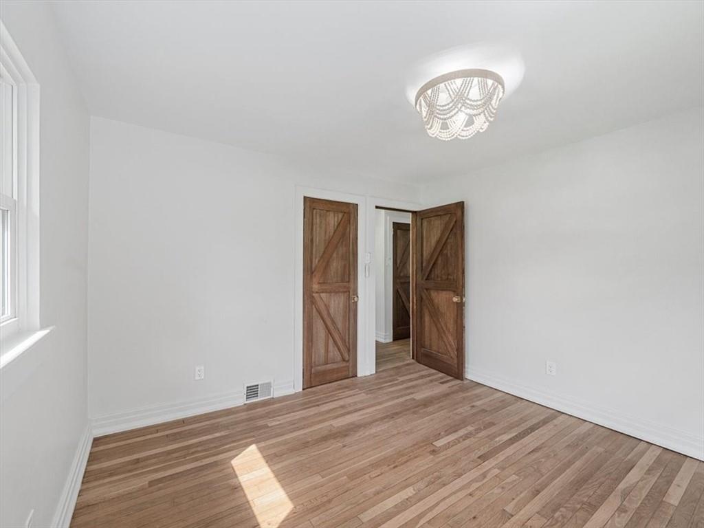 1403 Blackhawk Road Darlington, PA 16115 - Photo 22 of 29 a view of a room with wooden floor and a ceiling fan