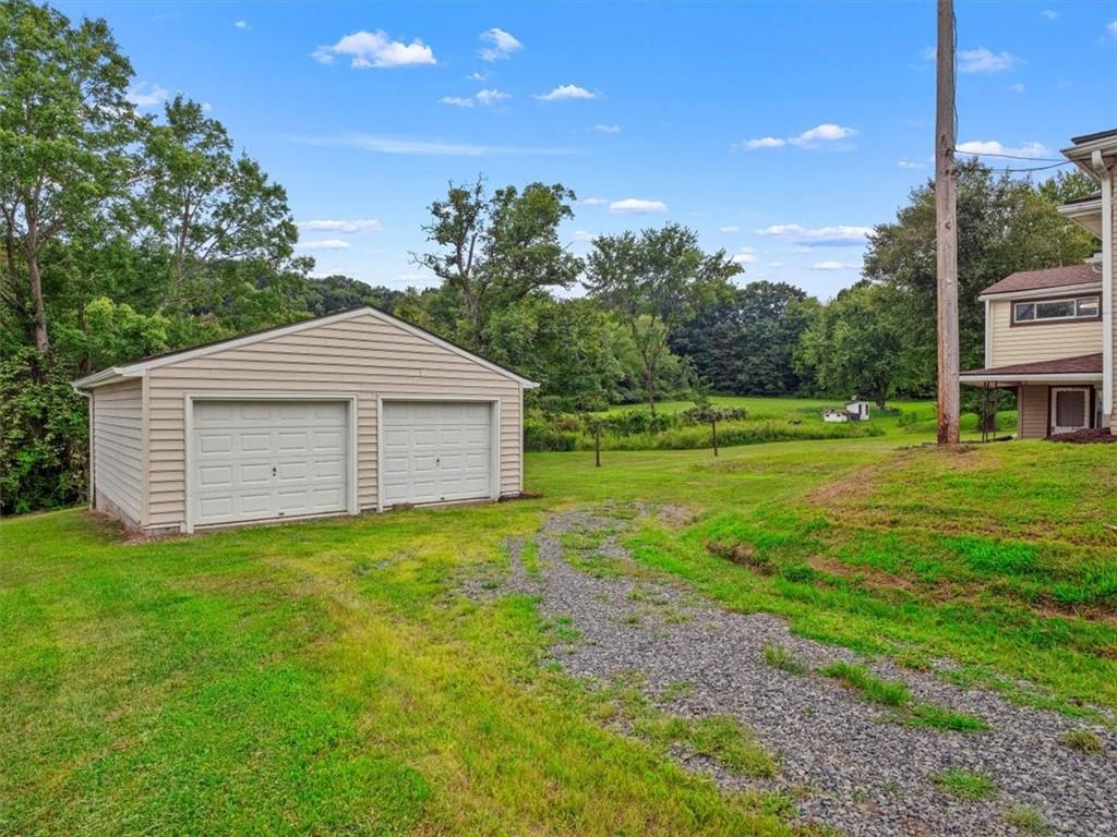 1403 Blackhawk Road Darlington, PA 16115 - Photo 27 of 29 a backyard of a house with table and chairs