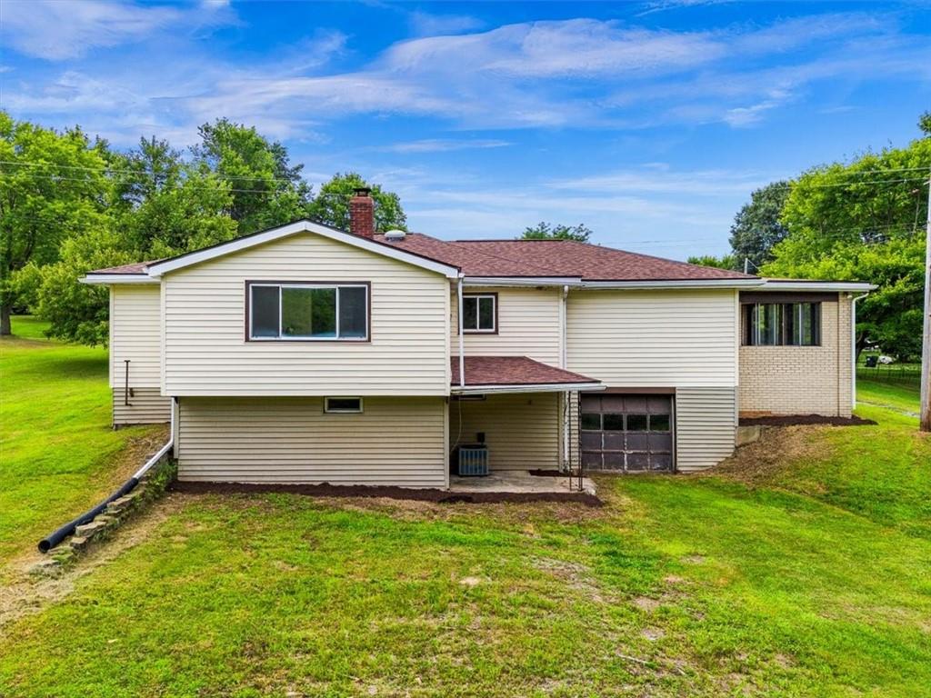 1403 Blackhawk Road Darlington, PA 16115 - Photo 28 of 29 a front view of a house with a garden