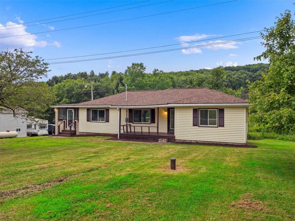 1403 Blackhawk Road Darlington, PA 16115 - Photo 3 of 29 a front view of a house with garden