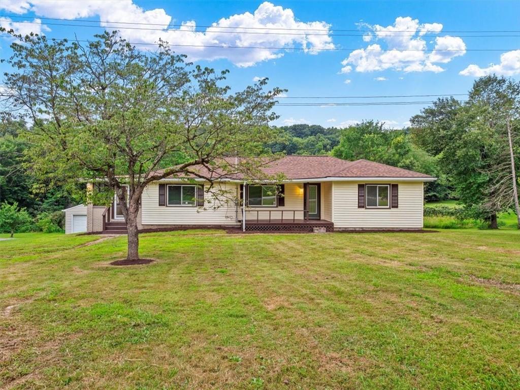 1403 Blackhawk Road Darlington, PA 16115 - Photo 4 of 29 a front view of a house with a garden