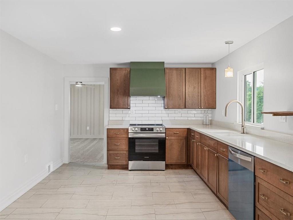 1403 Blackhawk Road Darlington, PA 16115 - Photo 10 of 29 a large kitchen with stainless steel appliances granite countertop a stove and a sink