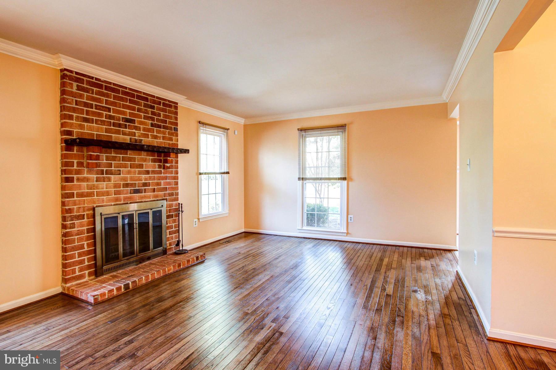 11526 Pine Cone Court Reston, VA 20191 - Photo 4 of 30 Raised Hearth Brick Fireplace and lots of windows!