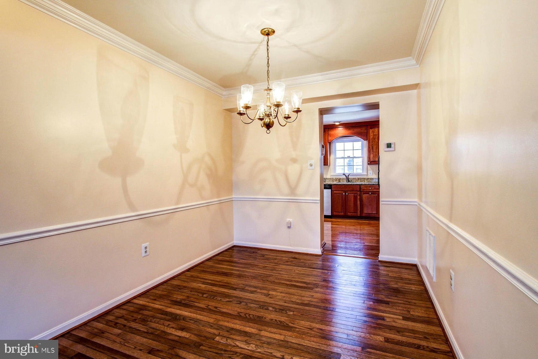 11526 Pine Cone Court Reston, VA 20191 - Photo 5 of 30 Crown and Chair Rail Molding in Dining Room