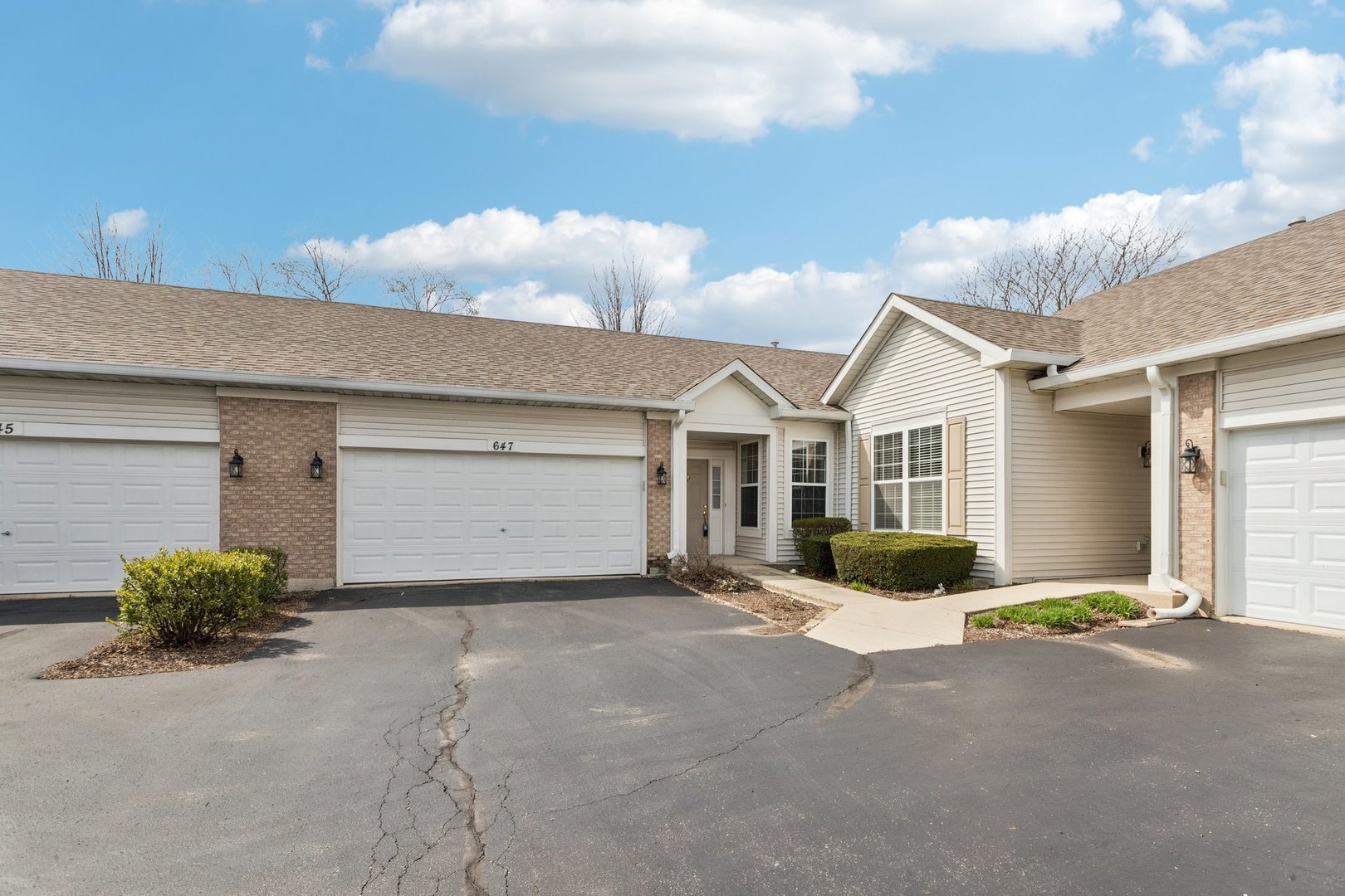 647 South Cadillac Circle Romeoville, IL 60446 - Photo 2 of 38 a view of a house with a yard and garage