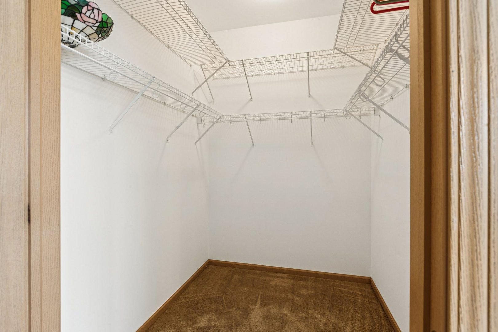 647 South Cadillac Circle Romeoville, IL 60446 - Photo 23 of 38 a view of a room with racks on the wall