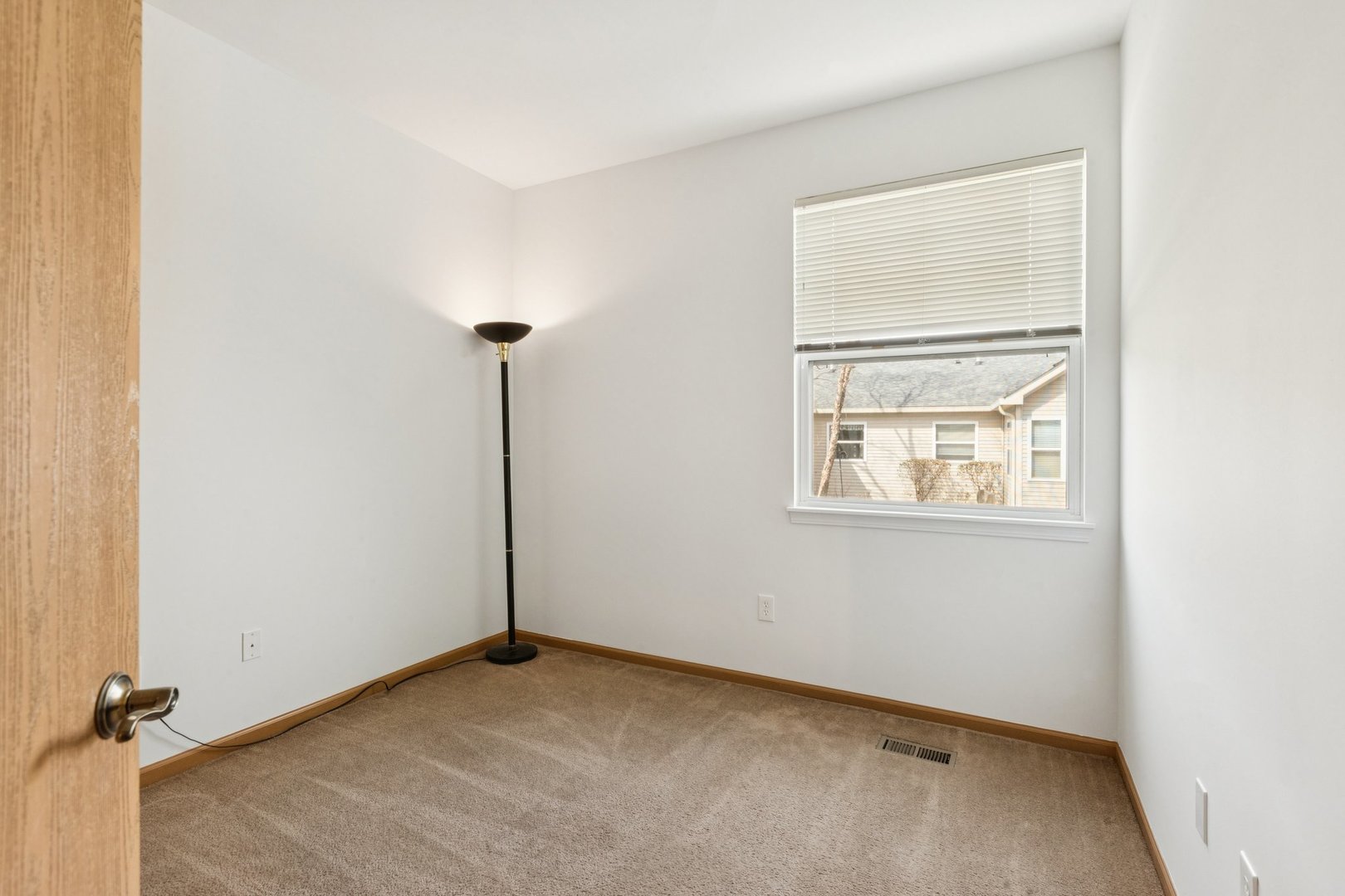 647 South Cadillac Circle Romeoville, IL 60446 - Photo 27 of 38 an empty room with windows