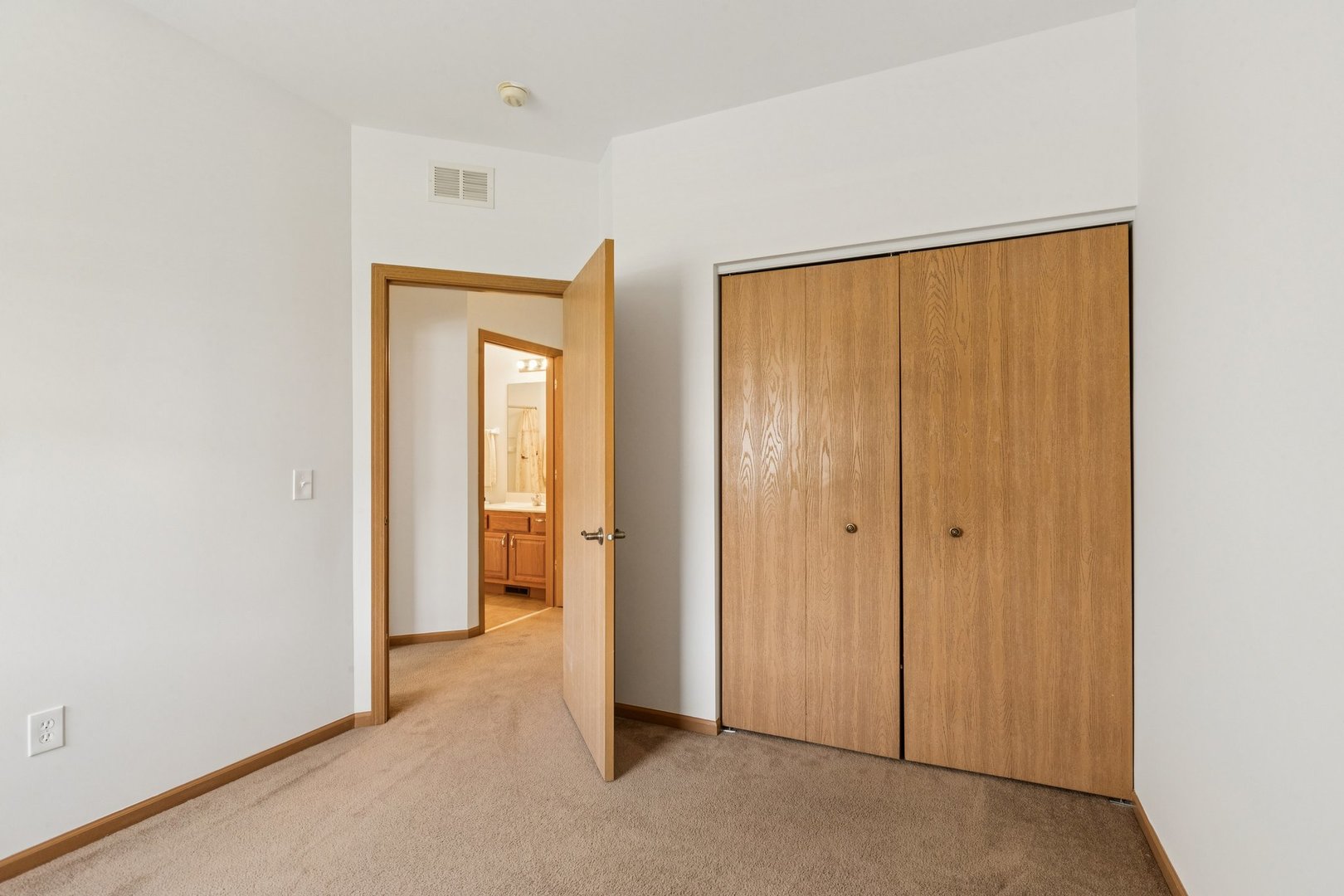647 South Cadillac Circle Romeoville, IL 60446 - Photo 28 of 38 a view of an empty room with closet and a window