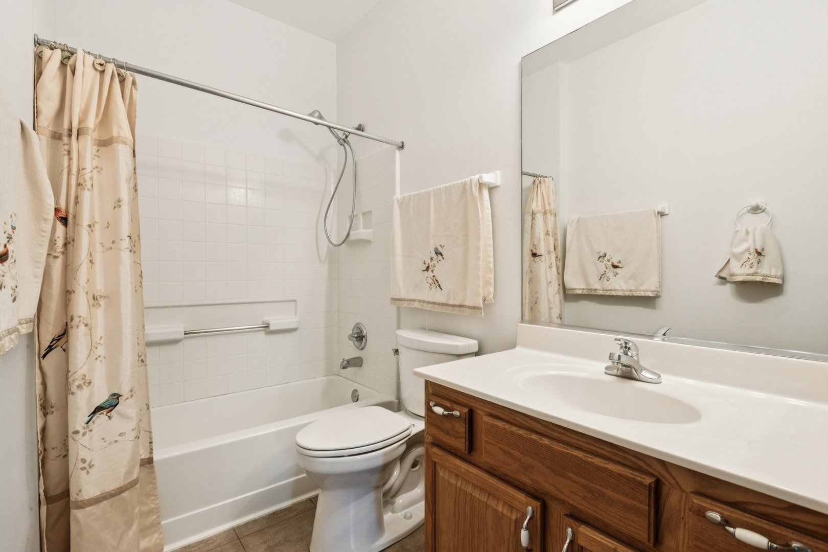 647 South Cadillac Circle Romeoville, IL 60446 - Photo 29 of 38 a bathroom with a sink a toilet and shower
