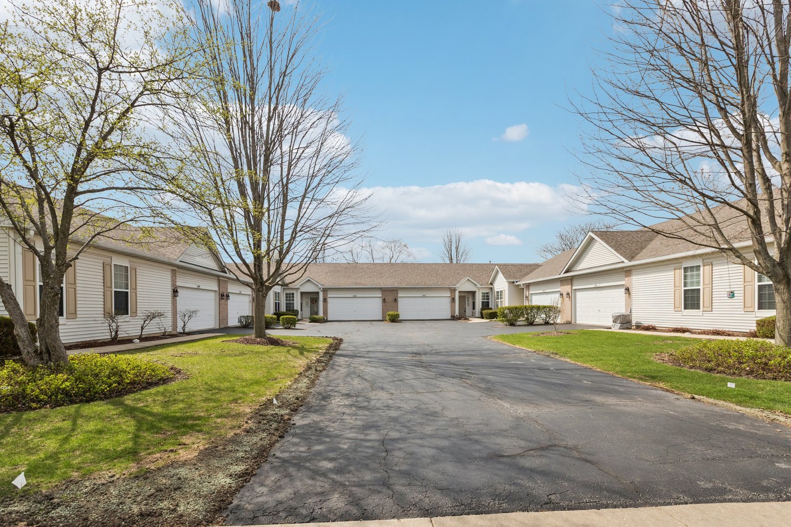 647 South Cadillac Circle Romeoville, IL 60446 - Photo 3 of 38 a view of a yard in front of a house