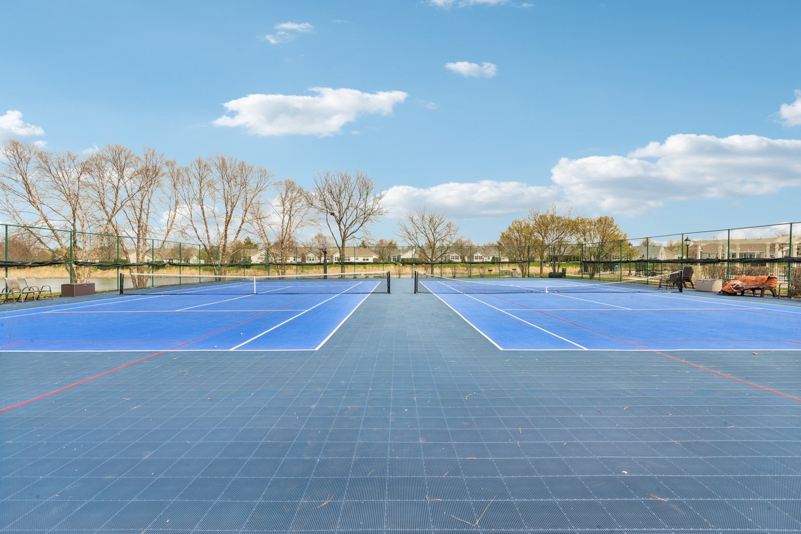 647 South Cadillac Circle Romeoville, IL 60446 - Photo 34 of 38 a view of an outdoor space and tennis court