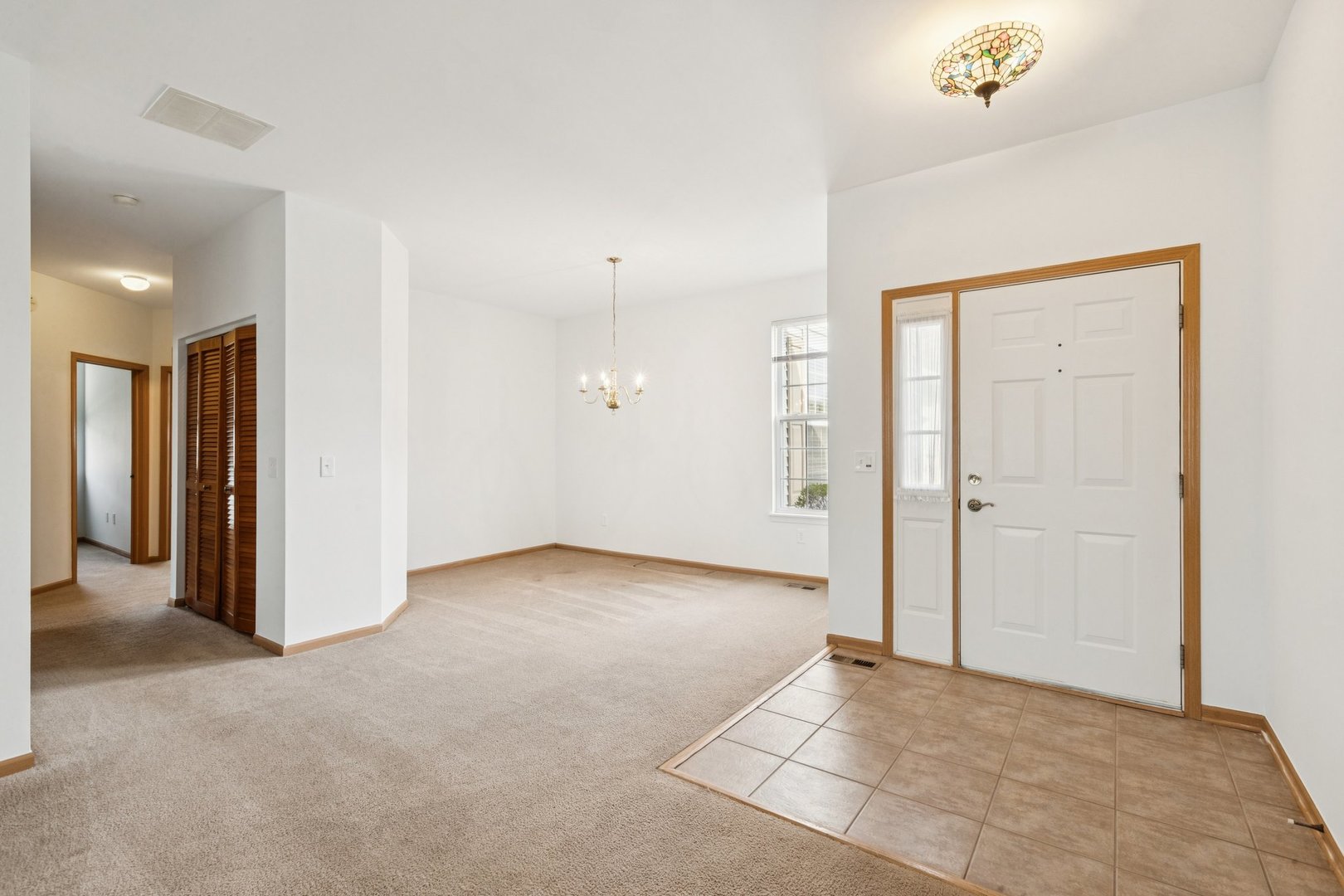 647 South Cadillac Circle Romeoville, IL 60446 - Photo 4 of 38 an empty room with windows