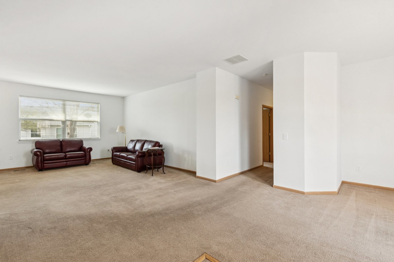 647 South Cadillac Circle Romeoville, IL 60446 - Photo 5 of 38 a view of livingroom with furniture and window
