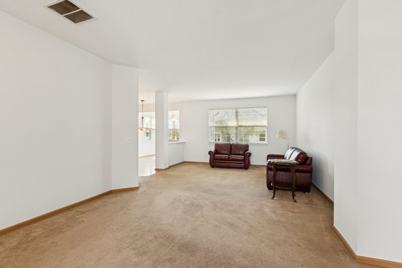 647 South Cadillac Circle Romeoville, IL 60446 - Photo 7 of 38 a living room with furniture and a window