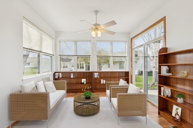 647 South Cadillac Circle Romeoville, IL 60446 - Photo 10 of 38 a living room with furniture a chandelier and a large window