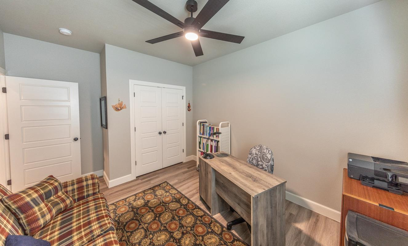 7002 103rd Street Lubbock, TX 79424 - Photo 17 of 28 a bedroom with a bed and a tv