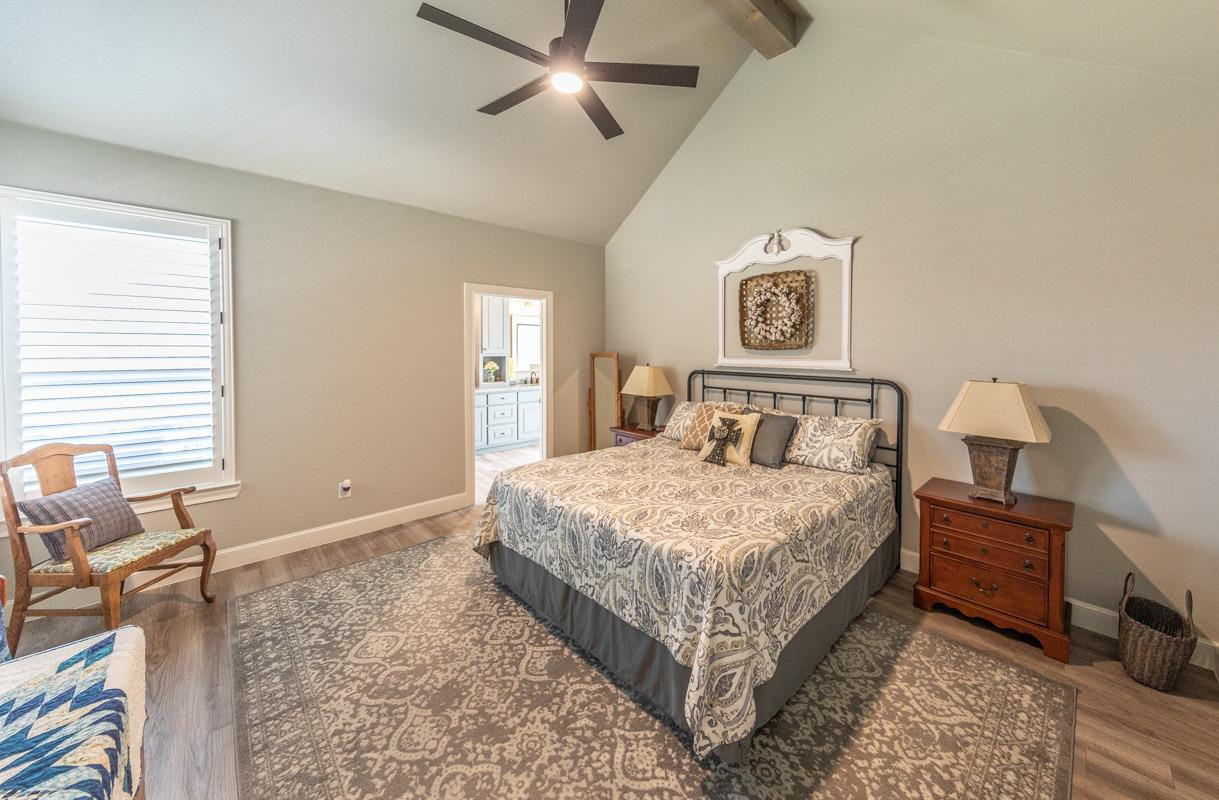 7002 103rd Street Lubbock, TX 79424 - Photo 20 of 28 a bedroom with a bed and a window