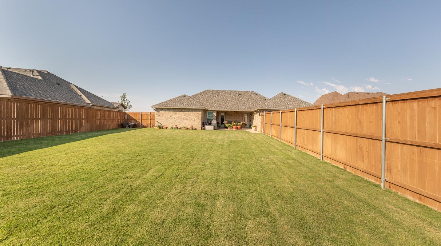 7002 103rd Street Lubbock, TX 79424 - Photo 26 of 28 a view of an outdoor space and a yard